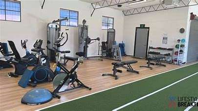Image of lifestyle breakthrough gym. In this image you can see exercise equipment, including exercise bikes, weights, balance balls