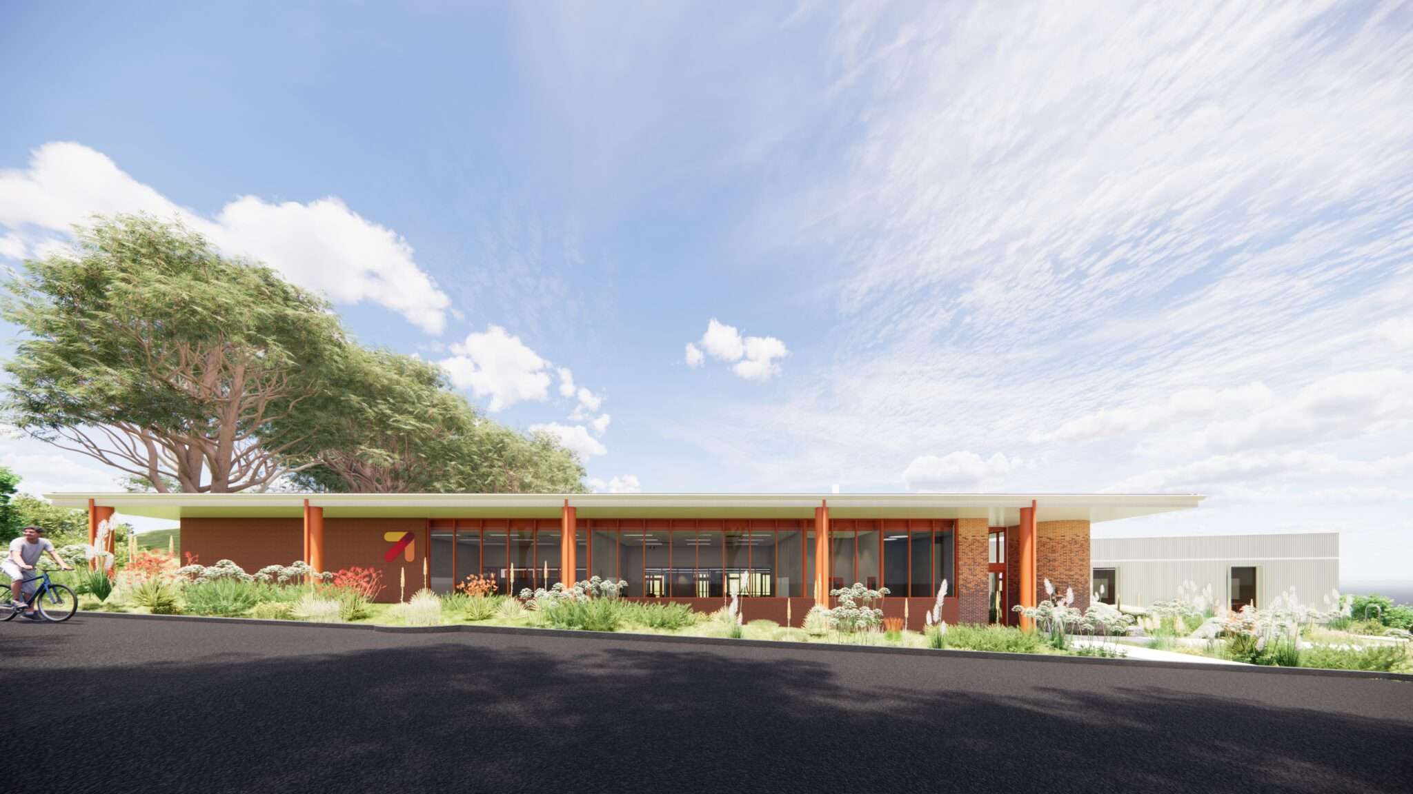 A large red brick building of classrooms and gym.