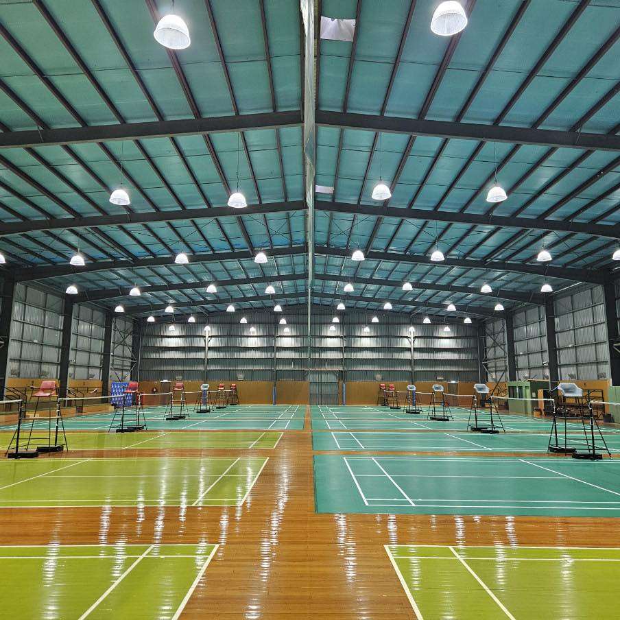 A large indoor stadium with 10 badminton courts.