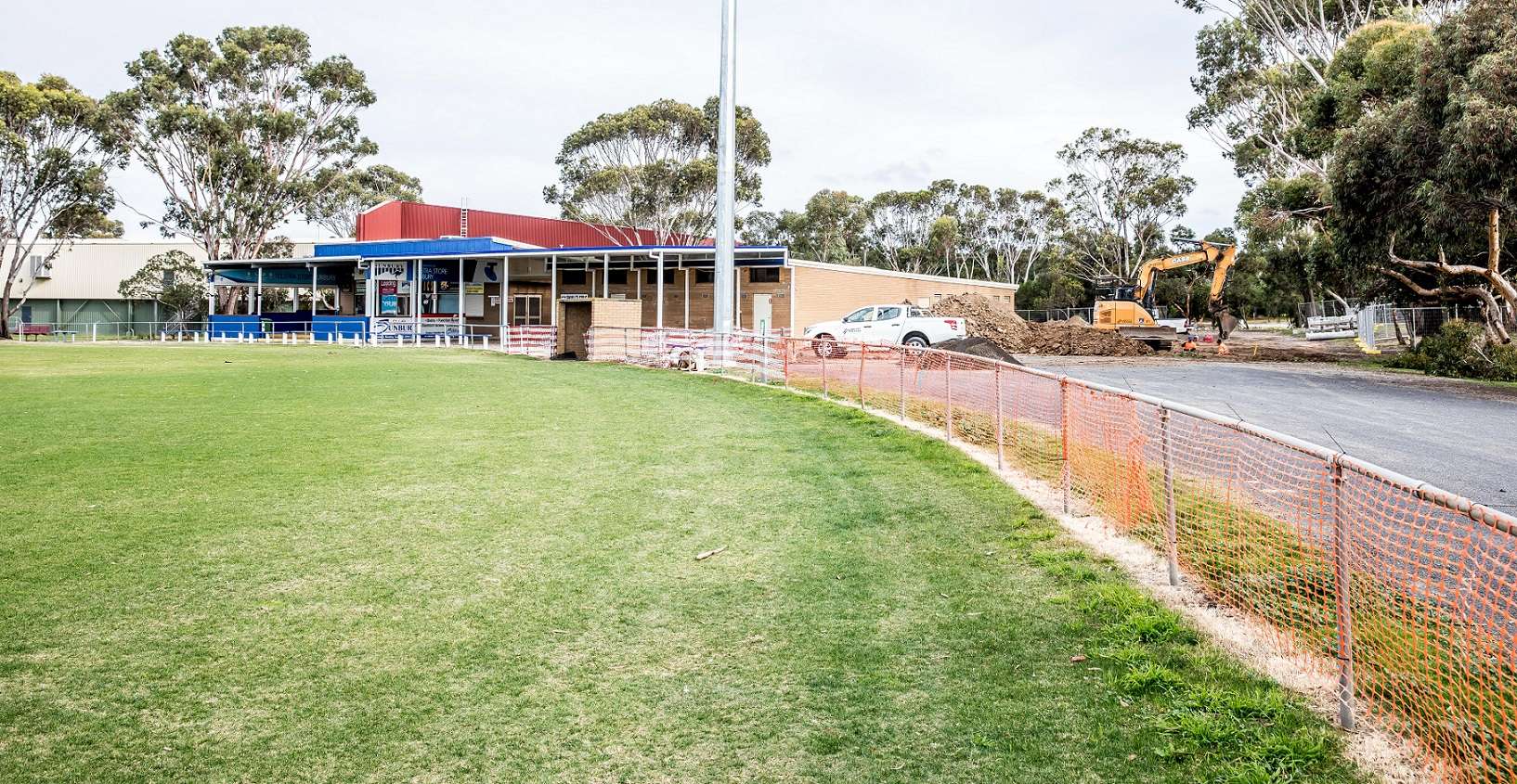 Green oval with clubrooms and construction happening