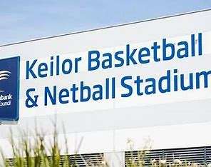 Image displays Keilor Basketball and Netball Stadium. Blue signage on a grey background