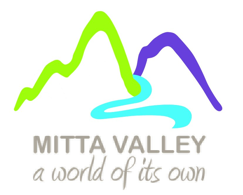 Colorful logo for Mitta Valley featuring stylized mountains and a river, with the tagline "a world of its own" beneath.