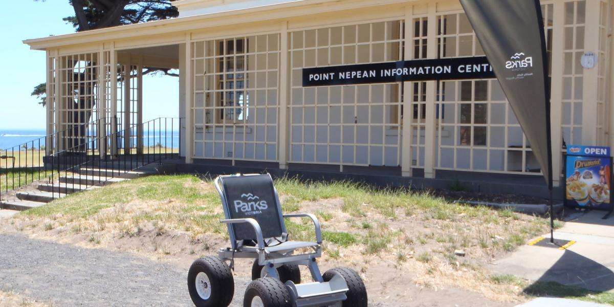 Off-road wheelchair in front of Point Nepean Information Centre.