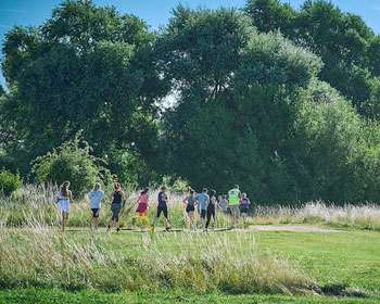 Image of outdoor space with people running in the distance