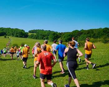 Open space with image taken from beihnd a group of people running