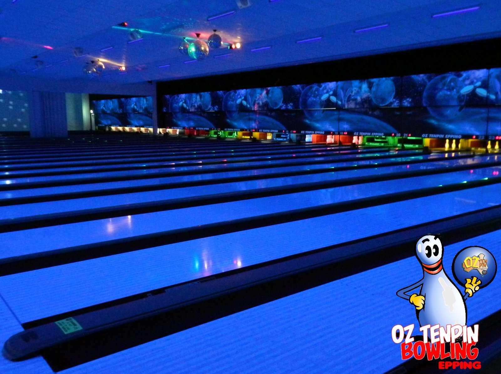 A photo of the bowling lanes with blue lighting