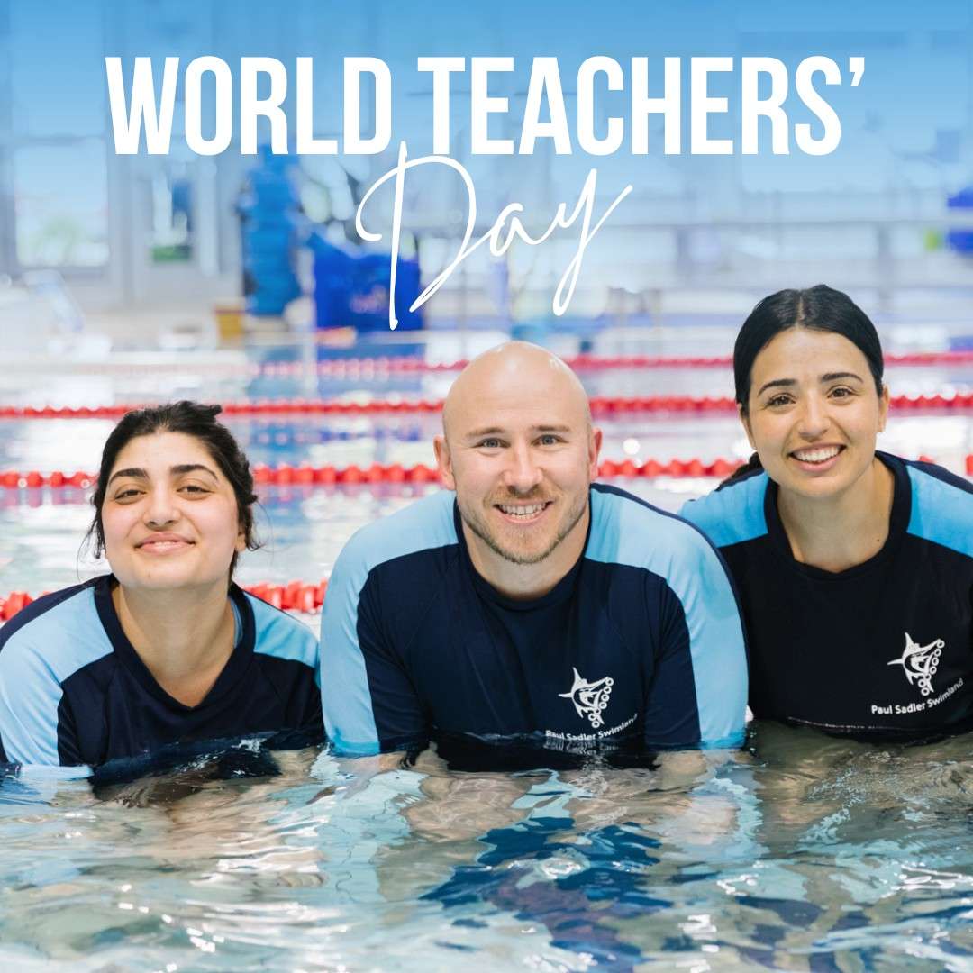 Three swim teachers smiling in the pool.
