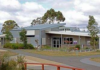 Image displaying Phoenix College, you can see trees around the building