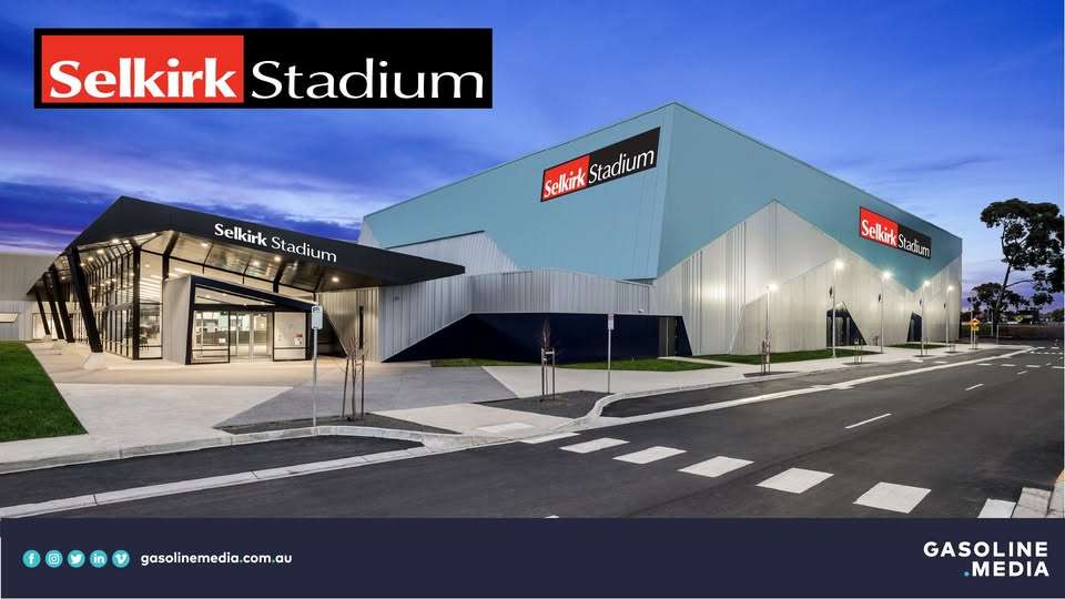 A large stadium with blue roof and full window entry.