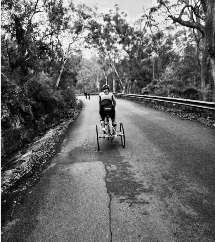Gabby Vassallo riding on a road in grayscale