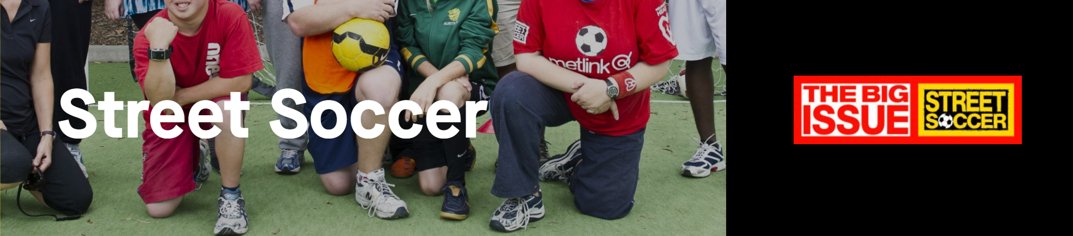 A group of diverse individuals in casual attire, engaged in street soccer, with a focus on teamwork and community.